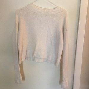 White, long sleeve, crop top sweater.